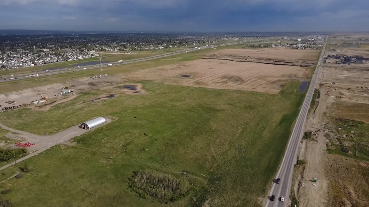 Drone photograph of the Hollins and Halstead lands east of Stoney Trail, looking across the site toward Calgary.