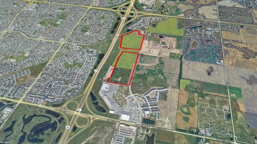 Aerial site map of the Hollins and Halstead lands east of Stoney Trail in east Calgary, with the parcel outlined in red.